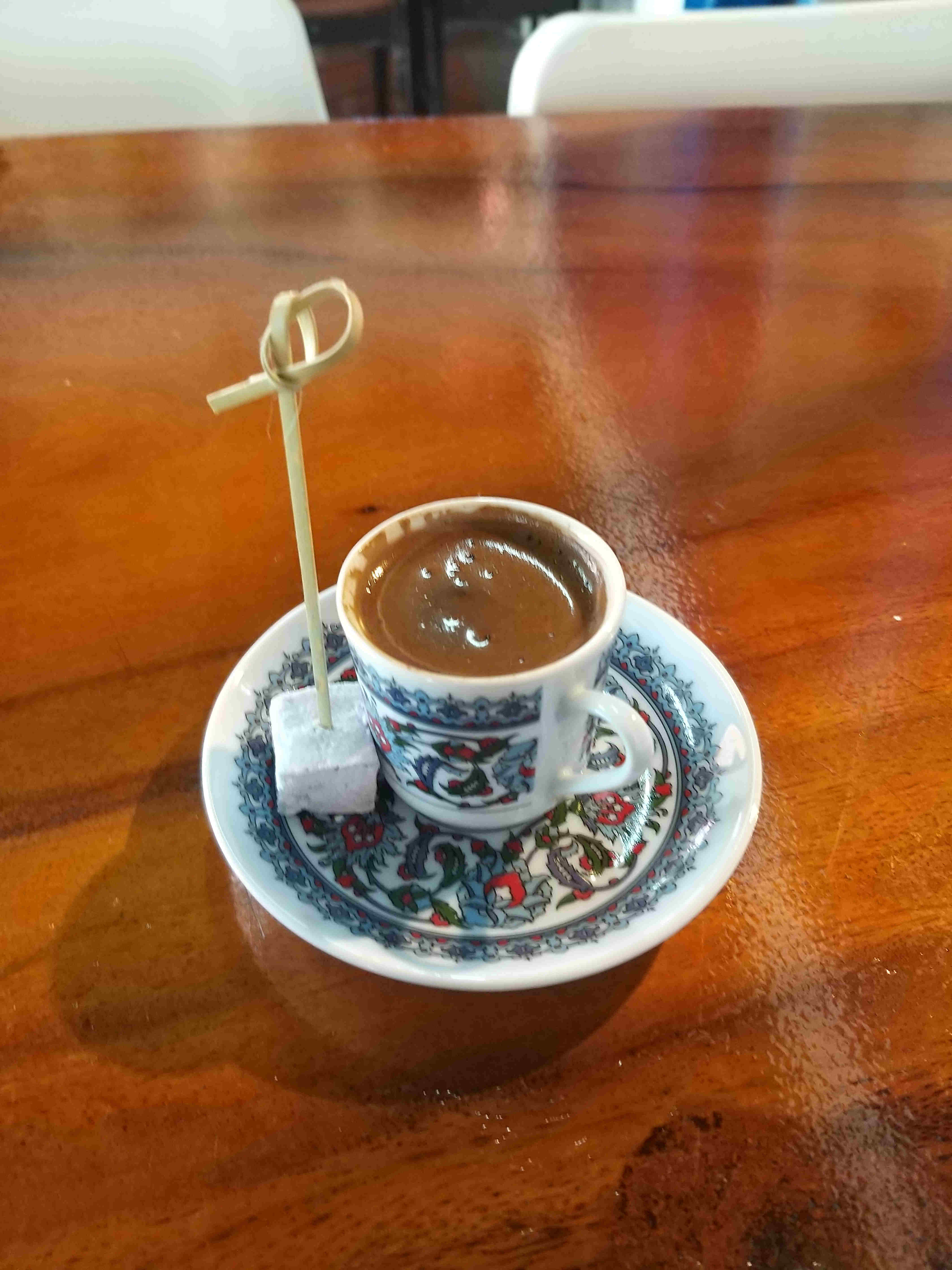 undrunken coffee in flowery cup