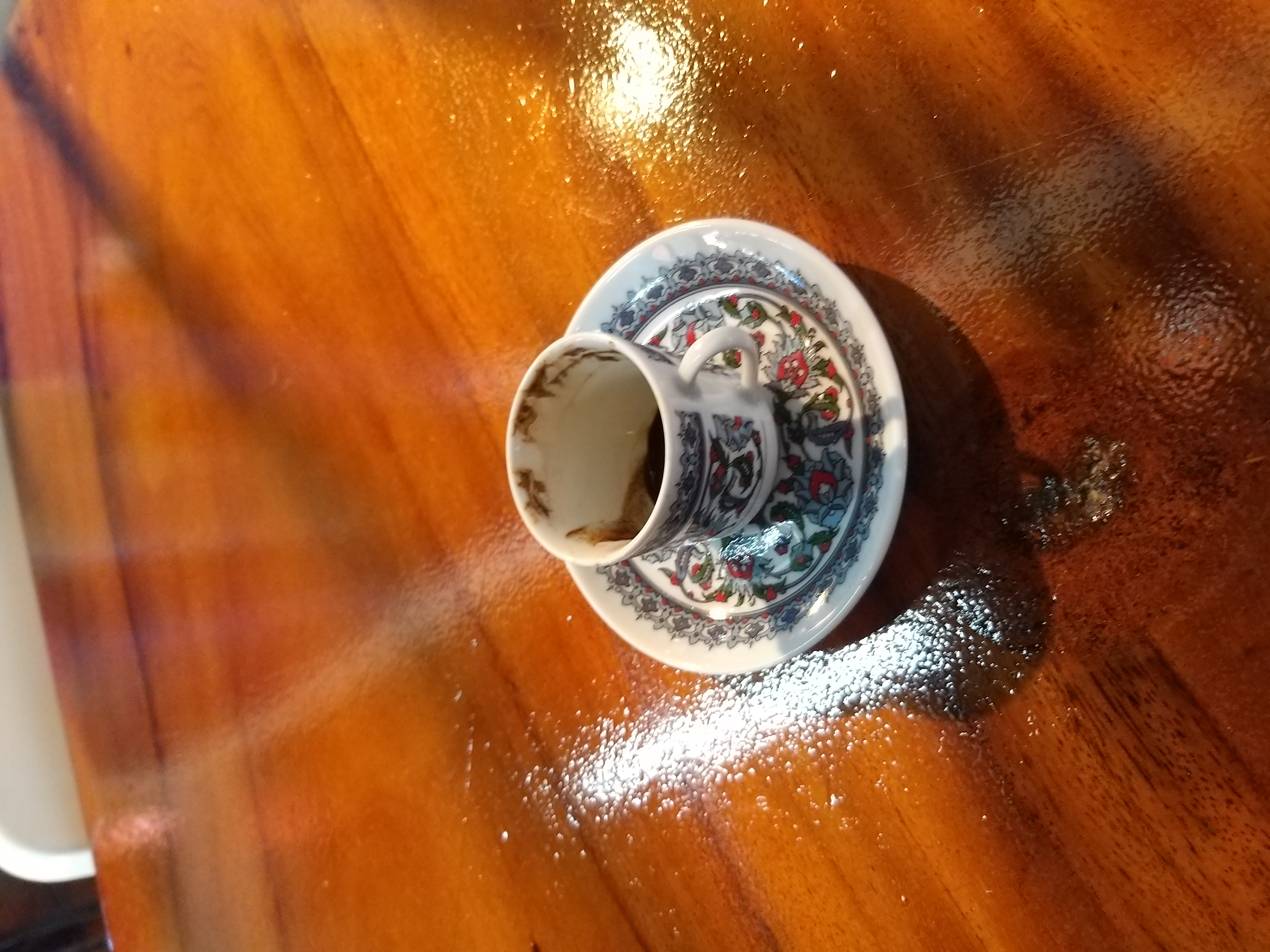 undrunken coffee in flowery cup